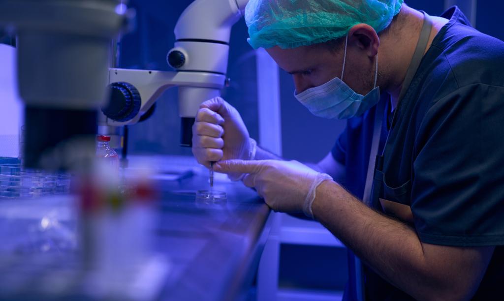 An embryologist focuses while at work in the lab.